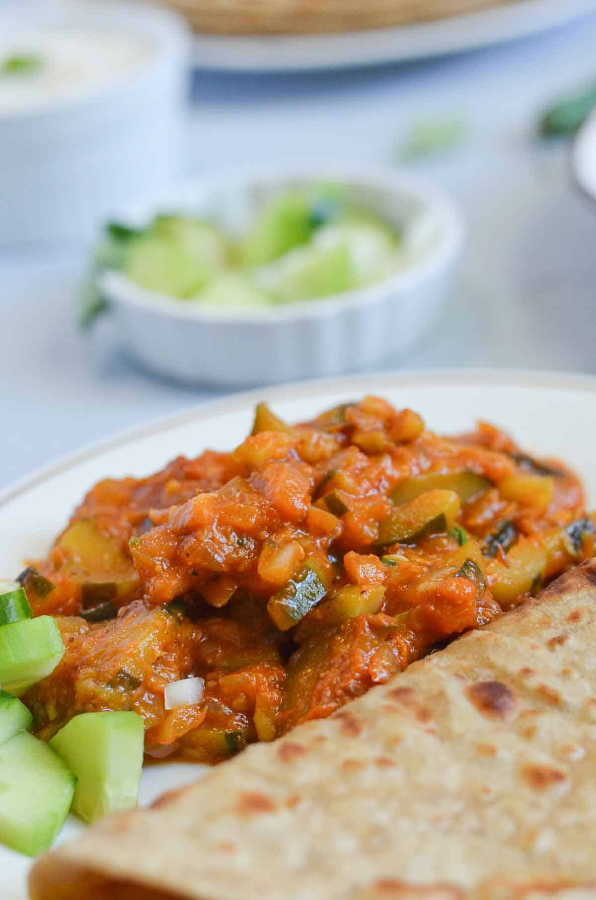 courgette curry served with flatbread (paratha)